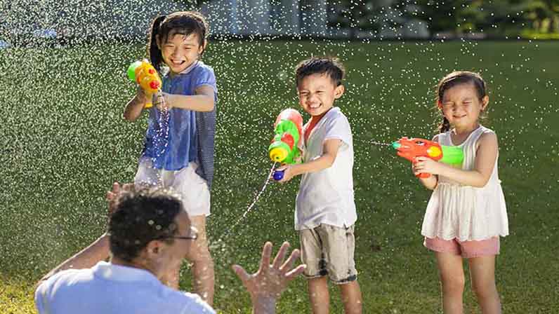 Kids are playing with water gun