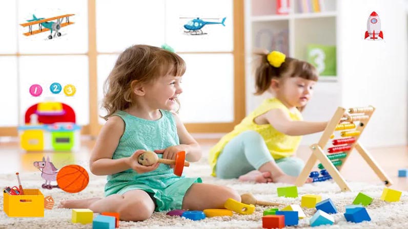 baby girls are playing with toys