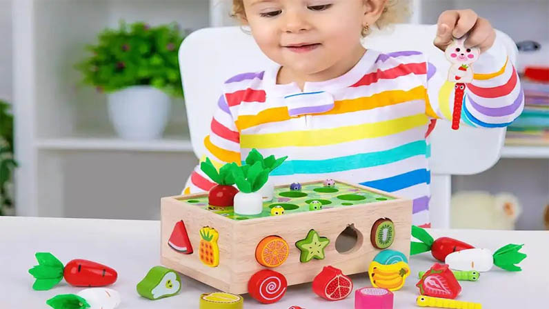 baby is playing with toys