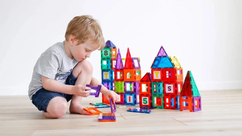 Kid is making a toy house