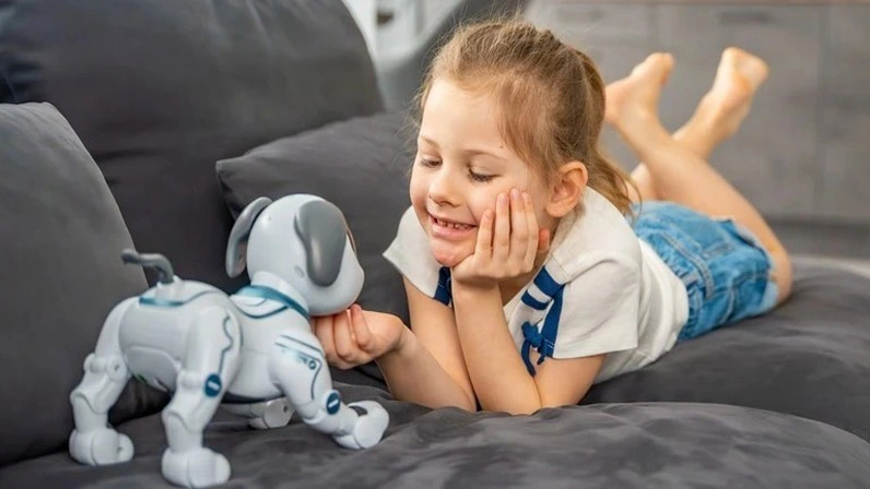 Baby girl is playing with smart toy