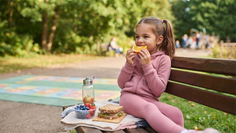 Kid is eating the breakfast
